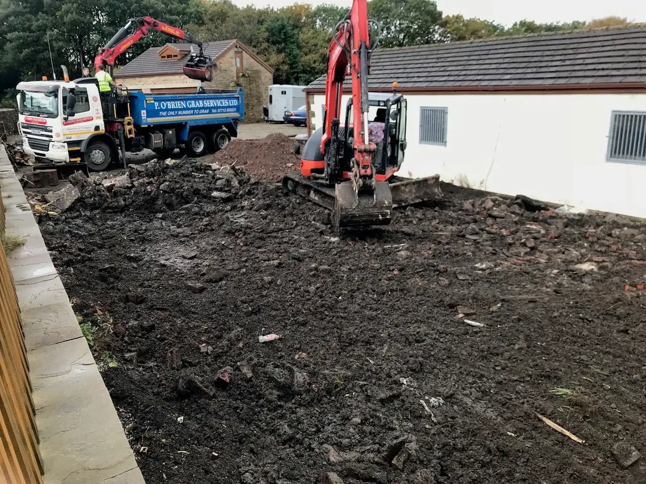 Marshalls & Son lorry and digger preparing a new driveway in Cumbria