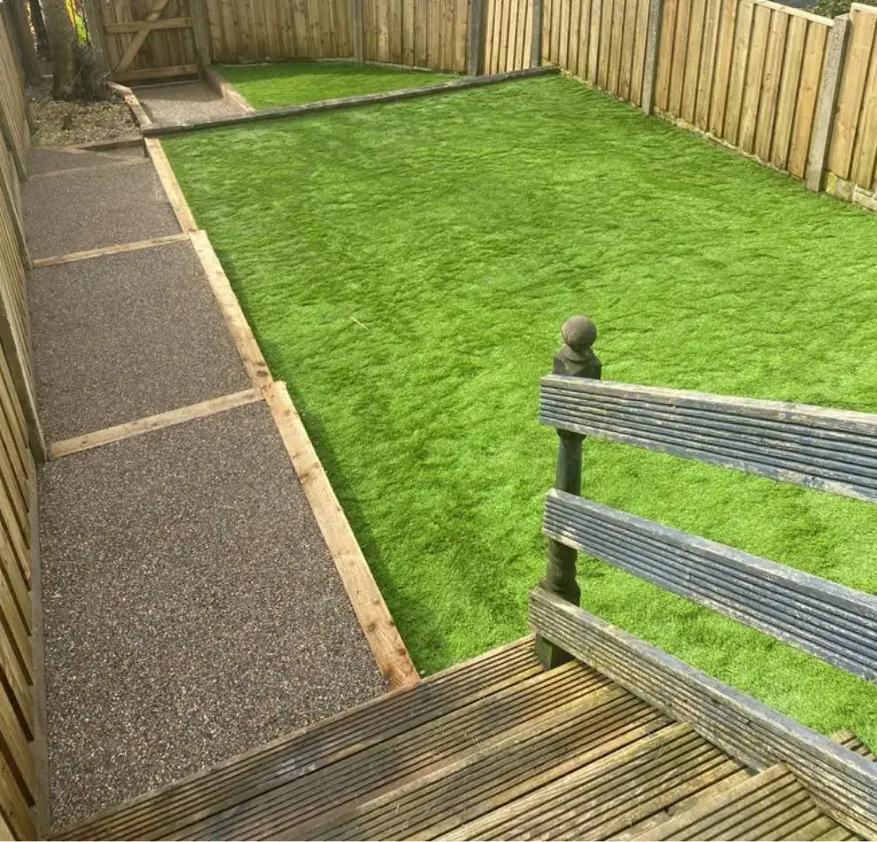 Garden with a new lawn and resin path by Marshalls & Son