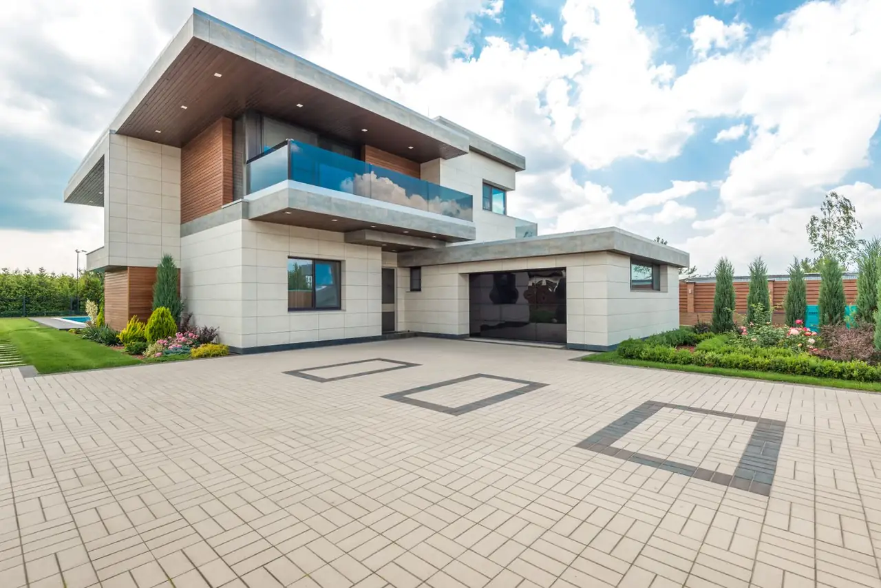 Modern house with a block paved driveway