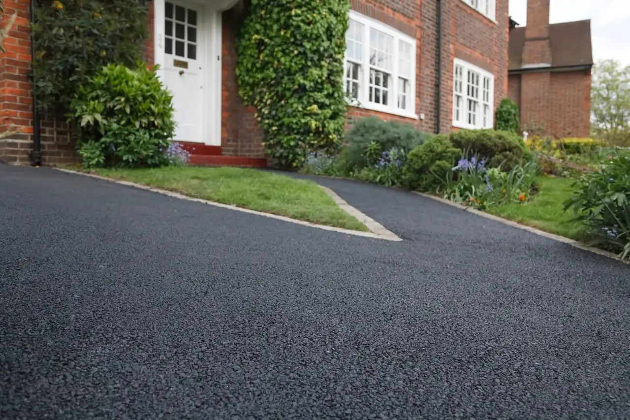 New tarmac driveway in front of a house